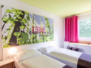 Postel nebo postele na pokoji v ubytování B&B Hotel Ingolstadt-Ost