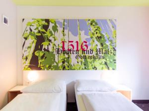 Postel nebo postele na pokoji v ubytování B&B Hotel Ingolstadt-Ost