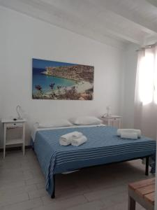 Un pat sau paturi într-o cameră la Villa Mattia