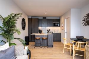 a kitchen and living room with a table and chairs at Apartments in Hayle in Hayle