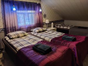 Postel nebo postele na pokoji v ubytování Reindeer Route Apartment