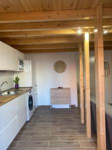 a kitchen with a table and a sink and a stove at Mar y reina in Puerto del Rosario