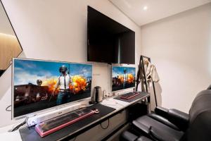 TV a/nebo společenská místnost v ubytování Cacao Hotel