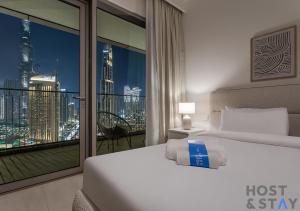 Voodi või voodid majutusasutuse Ramadan Luxury- Stay Your Way at Downtown Dubai toas