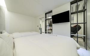 TV a/nebo společenská místnost v ubytování Cacao Hotel