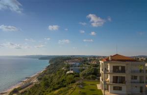 a view of a building and the ocean at Aegean Blue Horizon in Afitos