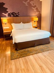Una cama o camas en una habitación de 1 Bedroom Executive Suite apartment at The H Tower Kuningan Jakarta by Lorenso