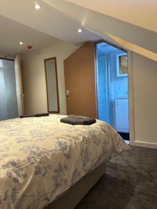 a bedroom with a large bed in a room at Luton Home near Airport Private & Shared Bathroom Option in Luton