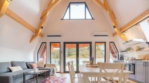 a living room with a couch and a table at Relax Cabins in Cristian