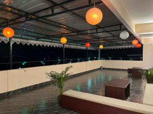 a swimming pool with orange lights in a building at Little Sikkim Inn in Gangtok