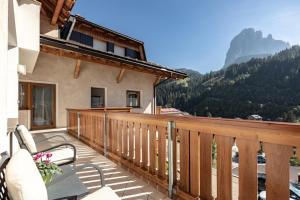 a balcony with a view of a mountain at Apartments Soval in Santa Cristina Gherdëina