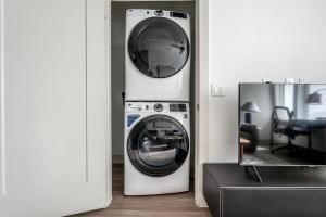 a washer and dryer sitting in a room at Downtown 1br w deck gym nr Congress Ave ATX-208 in Austin