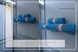 a row of blue towels on a shelf at Hostal Turismo Cruz de Piedra EIRL-Cajamarca in Cajamarca