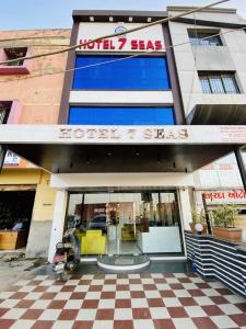 a hotel shaq room with a checkered floor at Hotel 7 Seas in Mundra