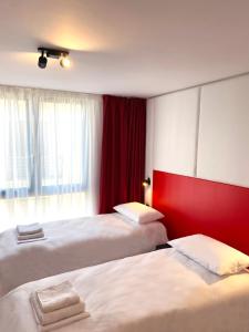 Postel nebo postele na pokoji v ubytování Citizen Suites