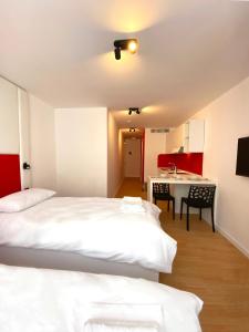 Postel nebo postele na pokoji v ubytování Citizen Suites