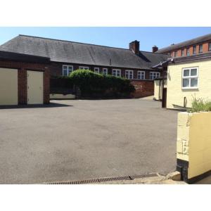 an empty parking lot in front of a building at Oak house hotel in Wellingborough