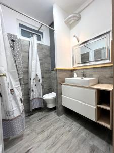 a bathroom with a sink and a toilet at 21 Gdynia Centrum - Apartament mieszkanie dla 2 osób in Gdynia