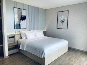 Cama ou camas em um quarto em Wins House - Apec Mandala Phú Yên
