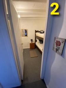 a hallway with a room with a bedroom with a bed at Departamentos Puerto Montt in Puerto Montt