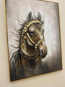 a painting of a horse head on a wall at Moon light in Sharīyah