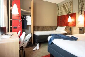 Postel nebo postele na pokoji v ubytování ibis Genève Centre Gare + 26 fotografií