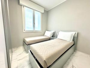 מיטה או מיטות בחדר ב-Donnino Apartments