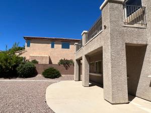 a large brick building with a driveway in front of it at Peaceful Oasis 4 bedroom in Summerlin close to Redrock in Las Vegas
