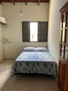 Postel nebo postele na pokoji v ubytování Casa Pequizeiro
