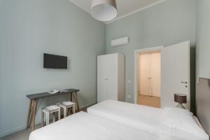 Posteľ alebo postele v izbe v ubytovaní Apartments Florence-Ginori Terrace