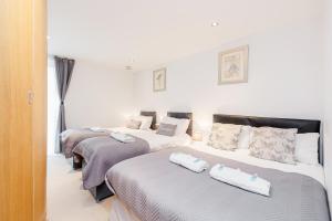 Łóżko lub łóżka w pokoju w obiekcie Premium Apartments By Excel