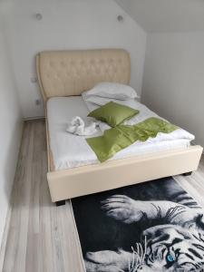 a bedroom with a bed with a zebra rug at VILA RAISA in Neagra Şarului +107 photos