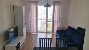 Televízia a/alebo spoločenská miestnosť v ubytovaní WROCLOVE_NET APARTMENTS