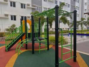 a playground with a slide in front of a building at Condo • WIFI up to 100mbps • Pool • Netflix&Chill in Cebu City