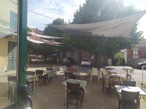 a group of tables and chairs under a tent at Da Teresa in Bardineto