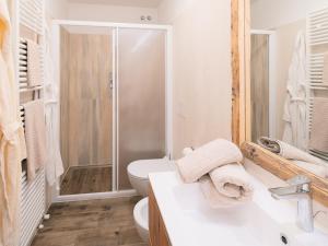 a bathroom with a toilet and a sink and a shower at CESA MARIN in Campitello di Fassa