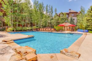 a swimming pool in a yard with a house at Seasons Lodge #101 in Edwards