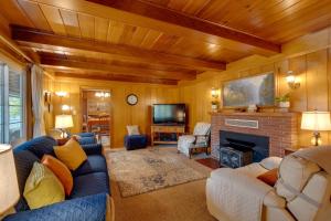 a living room with a couch and a fireplace at Game Room and Patio Charming Jackson Retreat! in Jackson