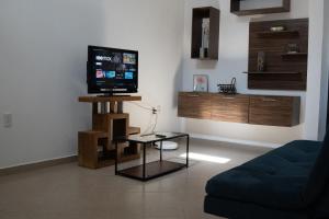Televízia a/alebo spoločenská miestnosť v ubytovaní La casita de la Bici