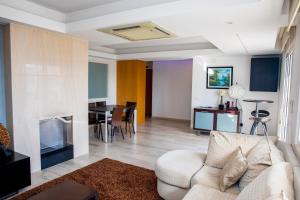 a living room with a couch and a table at CAS Living Fátima in Fátima