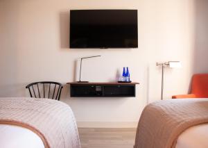 TV a/nebo společenská místnost v ubytování Meeting House Boutique Hotel + 16 fotografií