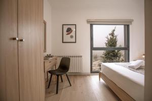 Voodi või voodid majutusasutuse Gloom 3-BR Apt in Tilal Faqra toas