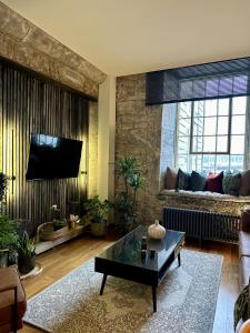a living room with a couch and a coffee table at Suite4SerenityRWY in Plymouth