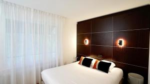 Postel nebo postele na pokoji v ubytování Boutique Logis Hôtel Relais de Vincey