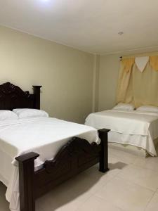 Postel nebo postele na pokoji v ubytování Grand Hotel Mirador Sur