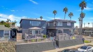 a house with a car parked in front of it at Tower 9 #2 in Oceanside