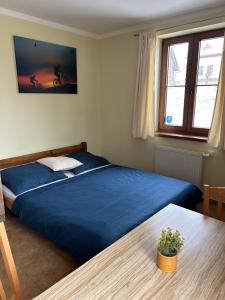 Posteľ alebo postele v izbe v ubytovaní Apartmány F - chata SVOBODĚNKA