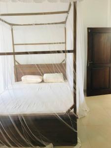 a bunk bed with two pillows on top of it at Samaro Resort in Matara