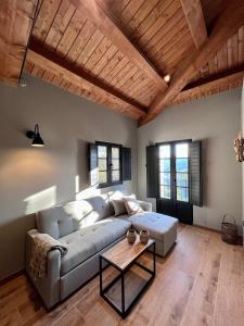 a living room with a couch and a table at Complejo Rural Casona de Labrada in Labrada