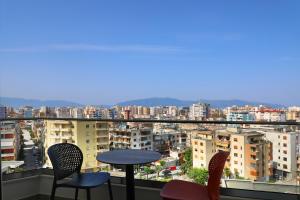 a view of a city from a balcony at Hotel VD Roleks in Vlorë